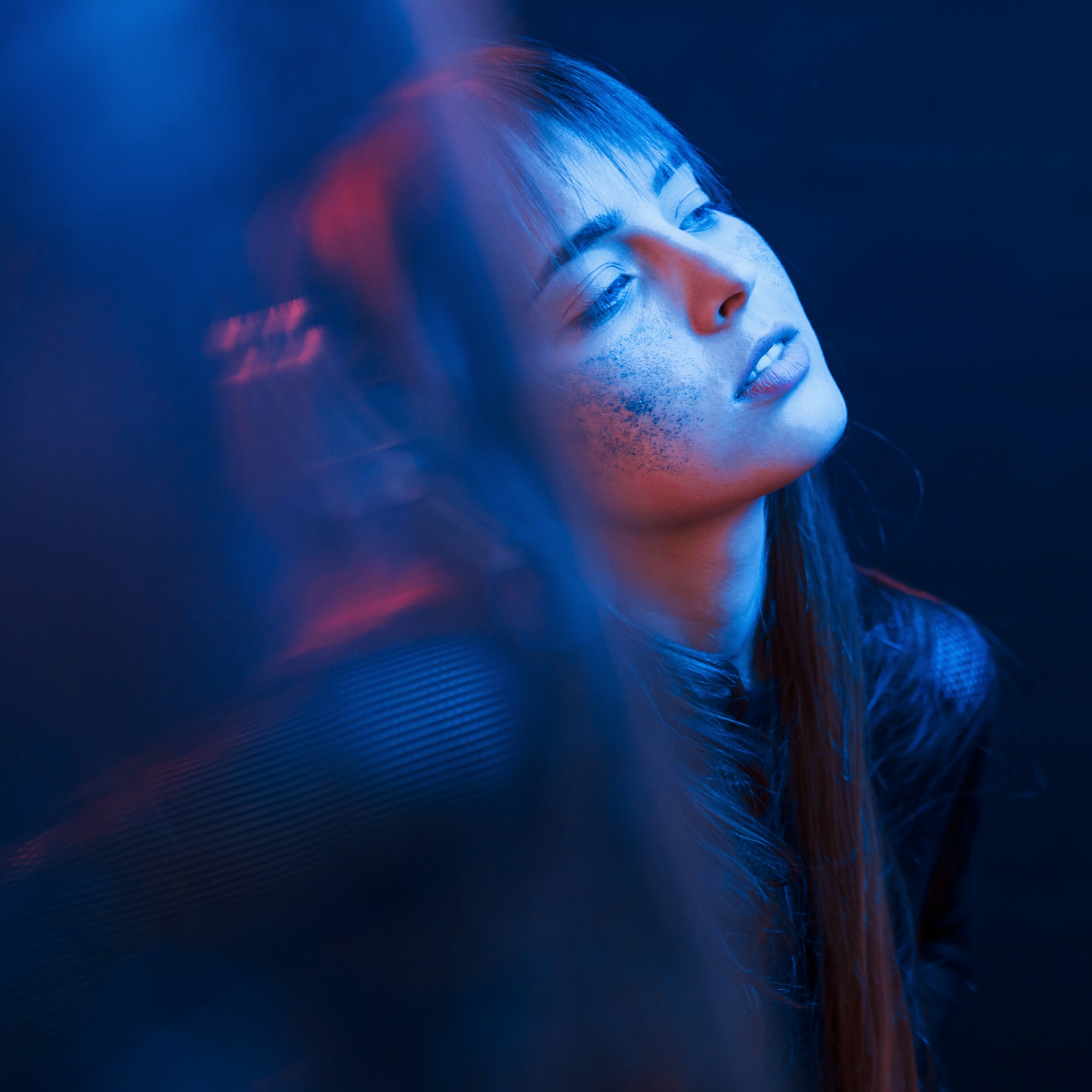 sensuality-and-enjoyment-studio-shot-in-dark-studio-with-neon-light-portrait-of-young-girl.jpg